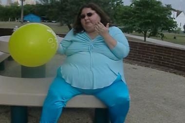 Just Blow It Big While Smoking - Sitting out side in a park, big vicki in blue spandex, blows up a huge yellow balloon! Her friend is worried it will pop but she is being real careful to not pop this one and to blow it very big as you will soon see! I was s b lowing smoke into this bal