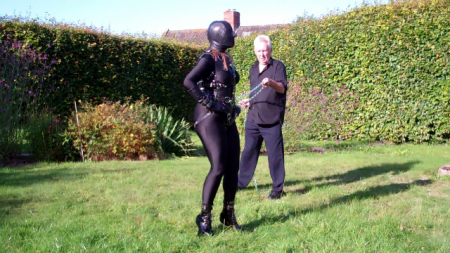 Thisgirl Walks Out In My Back Garden - The main feature in this clip is of 'thisgirl' dressed in a leather pony harness, wearing pony boots and being walked around my back garden at the end of a long steel chain.

the intensity of the training is increased by the addition of a severe leather hood that has only nostril holes.

the clip opens with 'thisgirl' dressed in a leather hobble dress, boots and armbinder walking around the garden.

'thisgirl' has a blog that can be found here: thisgirl.Wordpress****/  

the made-to-measure pony harness was supplied courtesy of locked4infinity (http://****lockedforinfinity****/store/theharness).