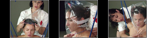 In The Bag Part 1 - A seriously evil ********** torment. A bag is slipped over her head and sealed shut at the neck. What happens hext is just evil. The nurse slips a tube into the bag and slowly fills it with water as she practically drowns inside the plastic bag.