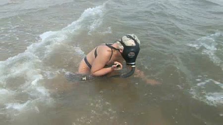 Kinky Scuba - Little miss chaos tries her hand at scuba diving but with a difference. Wearing only a sexy latex costume and gasmask she swims beneath the sea. Imagine visiting the beach and seeing chaos enjoying herself!!