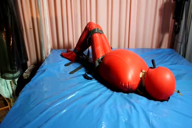Red Bondage Suit - Latex doll struggle in a red rubber bondage suit for freedom