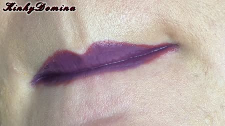 Outrageous Purple Lipstick - Luscious lips are being covered in thick layers of purple lipstick, then plumped by the application of holographic lip gloss.
