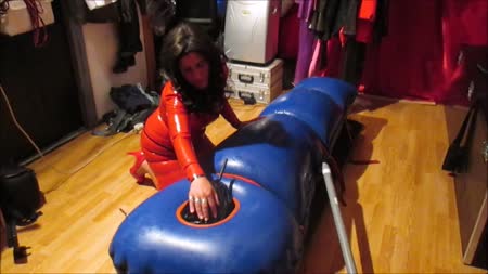 Rubbermistress Kim - Mistress kim can be sweet sometimes for her rubberslaves. But her bondages are always tight and extreme. She makes her slaves feel who is boss. In this clip she puts her slave first in a thick rubber suit and after that in a vacuum sack and ending with a heavy inflatable sleepsack for more pressure on his body. She controles his breathing and leaves him suffer for 2 hours